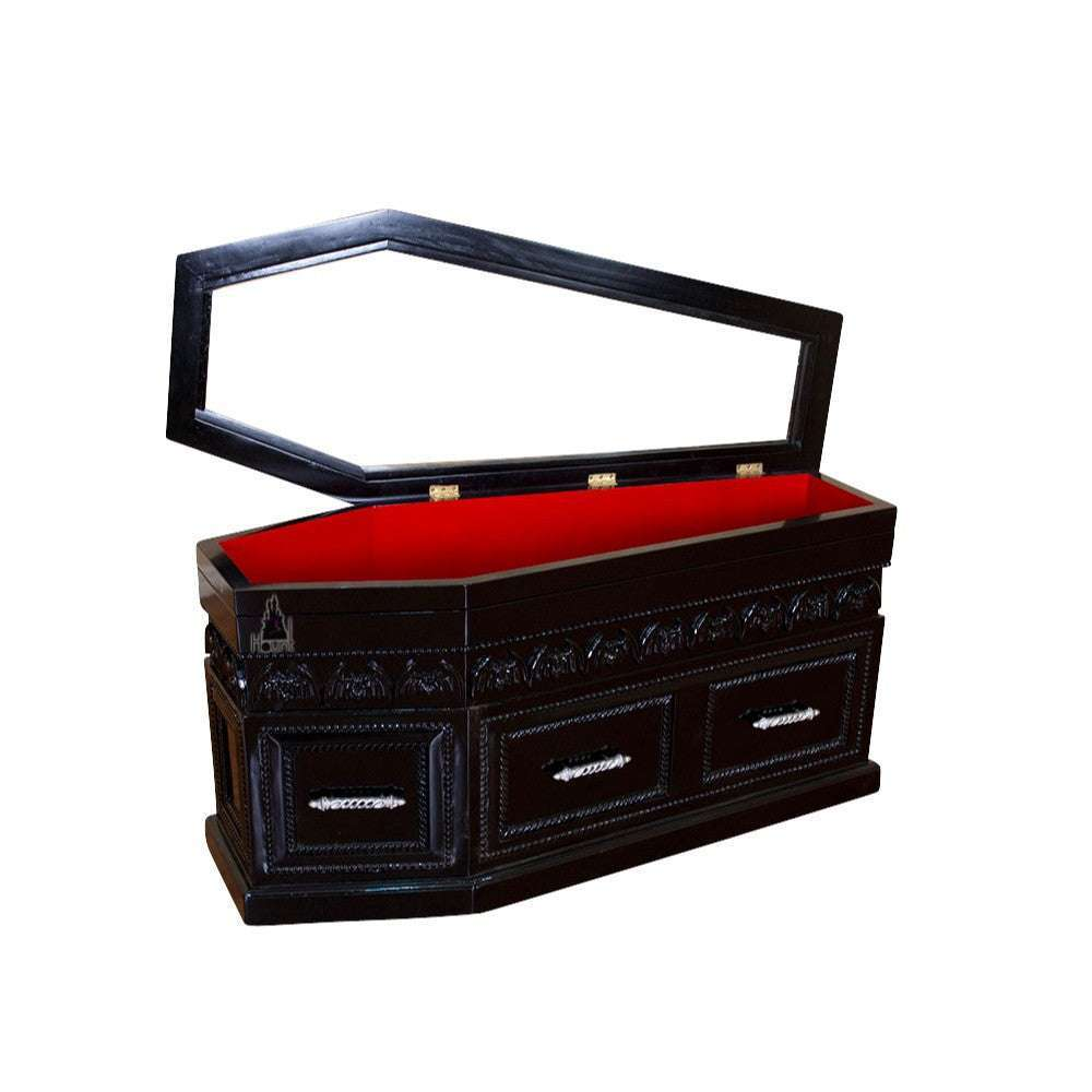 The Queen of the Damned Coffin Coffee Table, a handcrafted coffin-shaped coffee table with framed drawers and an opening glass-topped storage compartment.