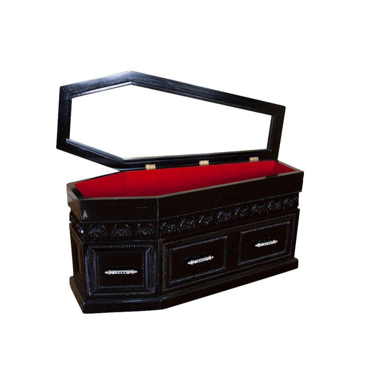 The Queen of the Damned Coffin Coffee Table, a handcrafted coffin-shaped coffee table with framed drawers and an opening glass-topped storage compartment.