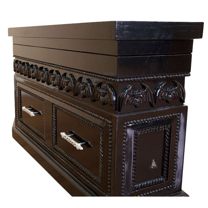 The Queen of the Damned Coffin Coffee Table, a handcrafted coffin-shaped coffee table with framed drawers and an opening glass-topped storage compartment.