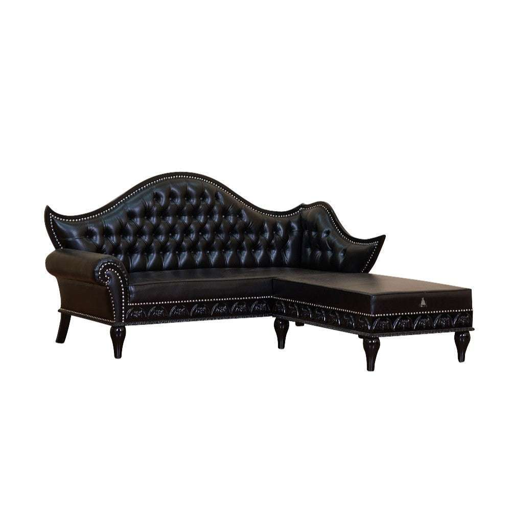 Queen of the Damned L-Lounge, a dramatic black L-shaped lounge with a high button-tufted back, chaise extension and carved gothic base