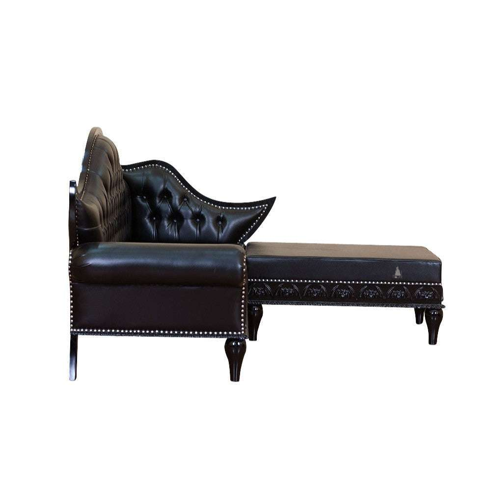 Another view of the Queen of the Damned L-Lounge, a dramatic black L-shaped lounge with a high button-tufted back