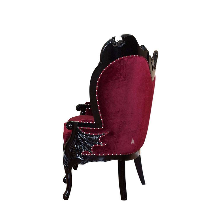 Another view of the Queen of the Damned Love Seat, a dramatic two-seat gothic sofa with deep red upholstery
