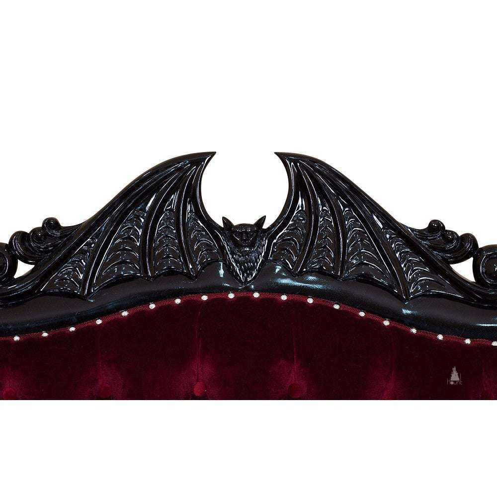 Another view of the Queen of the Damned Love Seat, a dramatic two-seat gothic sofa with deep red upholstery