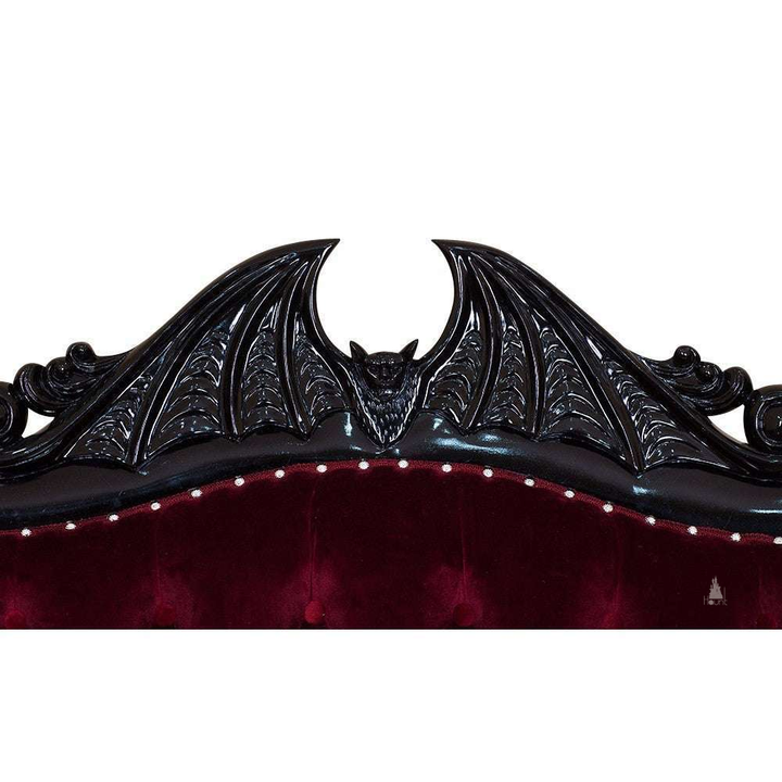 Another view of the Queen of the Damned Love Seat, a dramatic two-seat gothic sofa with deep red upholstery