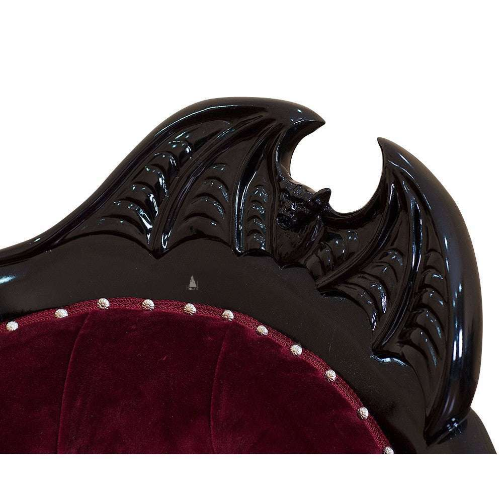 Another view of the Queen of the Damned Love Seat, a dramatic two-seat gothic sofa with deep red upholstery