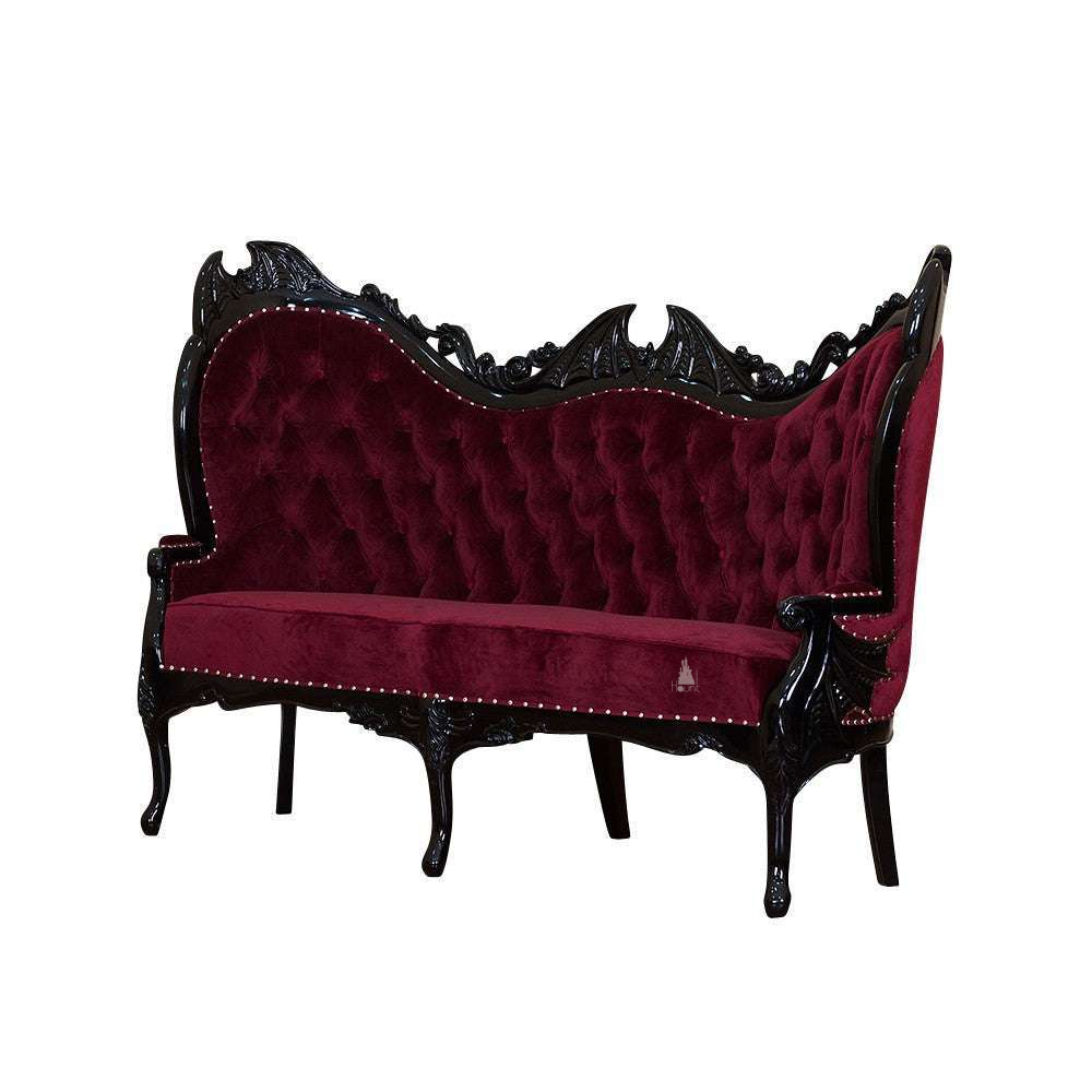 Another view of the Queen of the Damned Love Seat, a dramatic two-seat gothic sofa with deep red upholstery