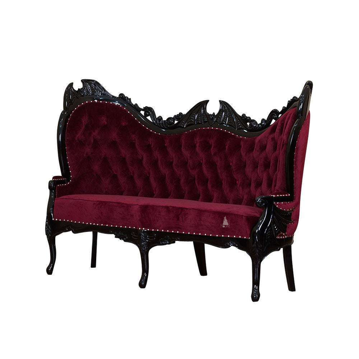 Another view of the Queen of the Damned Love Seat, a dramatic two-seat gothic sofa with deep red upholstery