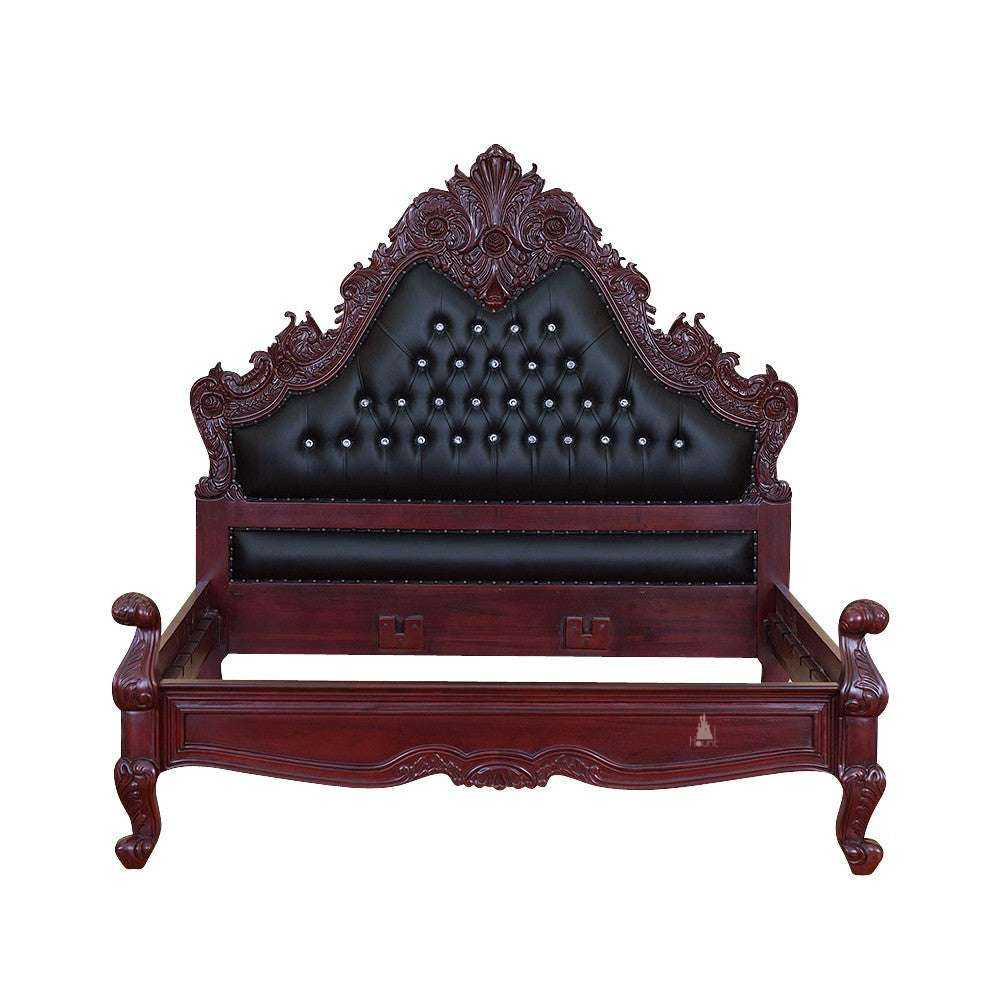 The Seduce Bedazzled Bed, a handcrafted gothic bed with ornate carved cresting, diamond-tufted upholstery and a low shaped footboard.