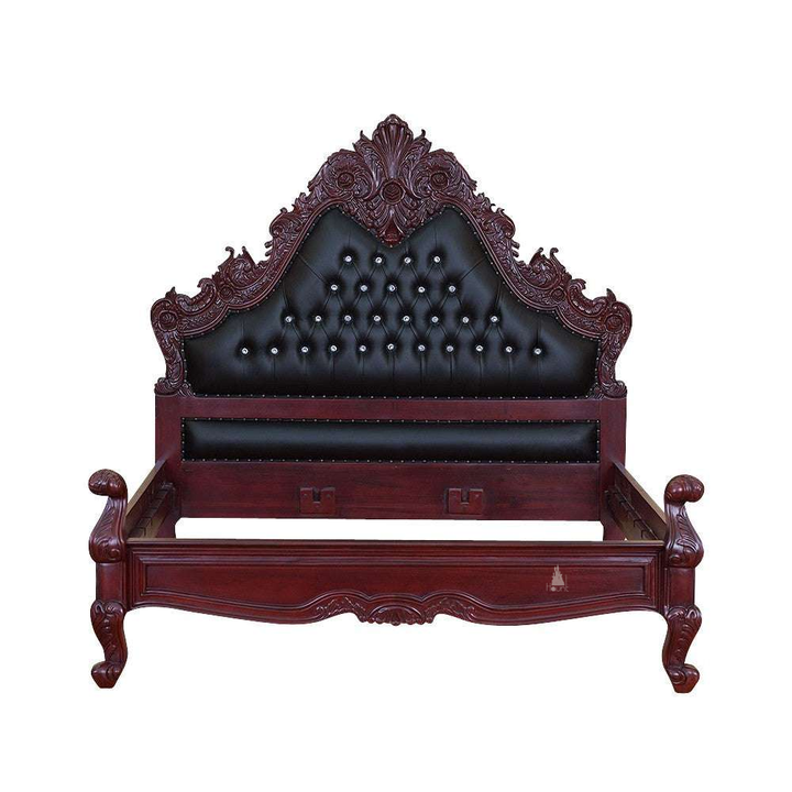The Seduce Bedazzled Bed, a handcrafted gothic bed with ornate carved cresting, diamond-tufted upholstery and a low shaped footboard.