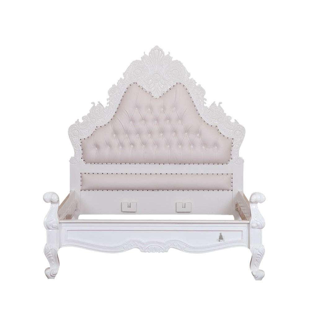 The Seduce Bedazzled Bed, a handcrafted gothic bed with ornate carved cresting, diamond-tufted upholstery and a low shaped footboard.