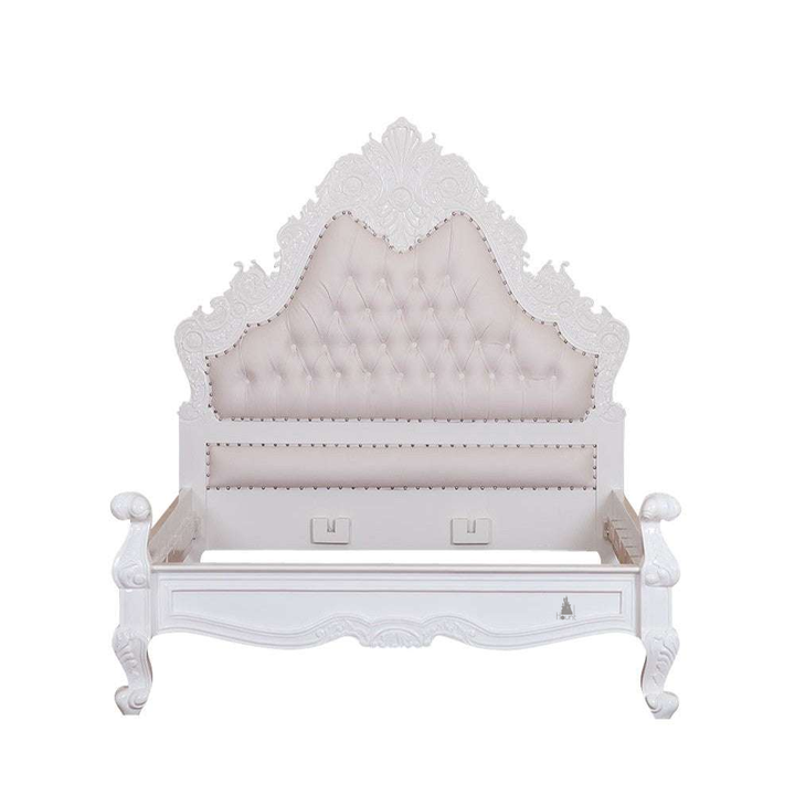 The Seduce Bedazzled Bed, a handcrafted gothic bed with ornate carved cresting, diamond-tufted upholstery and a low shaped footboard.