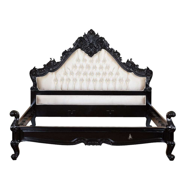 The Seduce Bedazzled Bed, a handcrafted gothic bed with ornate carved cresting, diamond-tufted upholstery and a low shaped footboard.