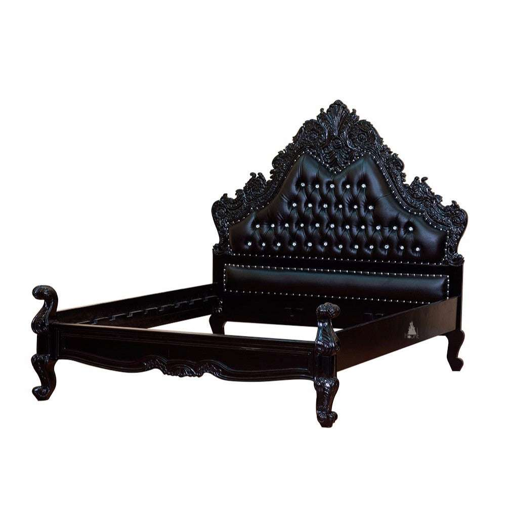The Seduce Bedazzled Bed, a handcrafted gothic bed with ornate carved cresting, diamond-tufted upholstery and a low shaped footboard.