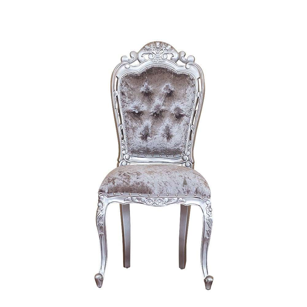 The Seduce Chair, a handcrafted gothic chair with a tall button-tufted back, carved crest and upholstered seat.