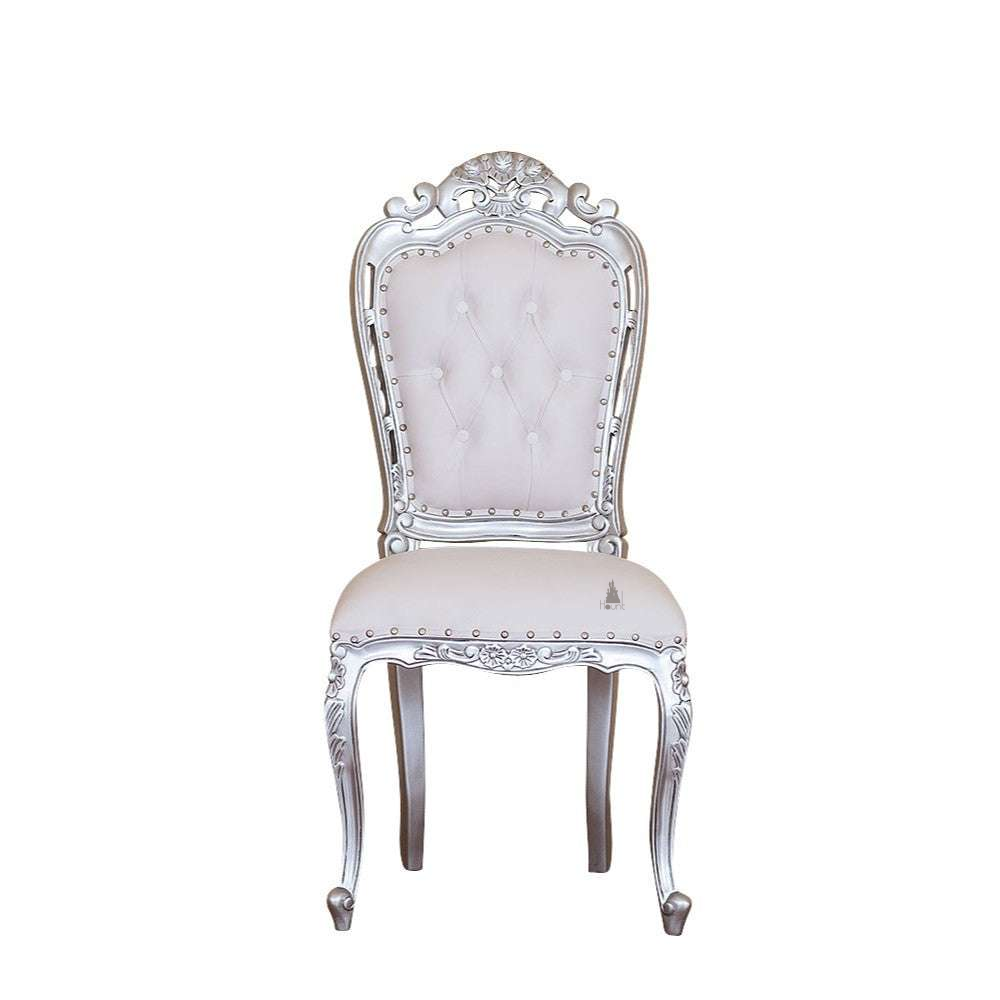 The Seduce Chair, a handcrafted gothic chair with a tall button-tufted back, carved crest and upholstered seat.