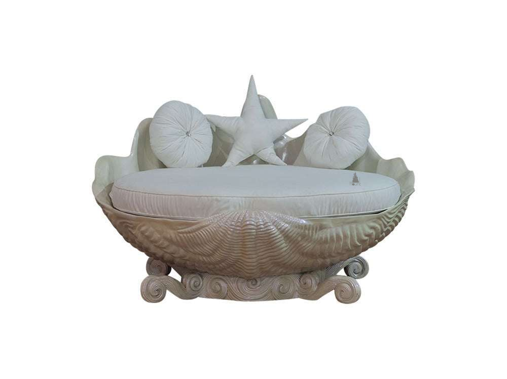The Sirens Two Seater Love Seat, a handcrafted sculptural shell-shaped lounge with cushioned seating and curled base detailing.