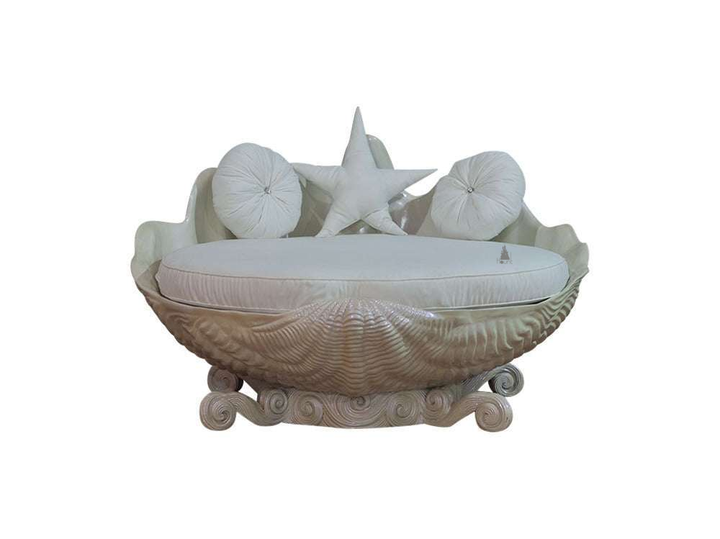 The Sirens Two Seater Love Seat, a handcrafted sculptural shell-shaped lounge with cushioned seating and curled base detailing.