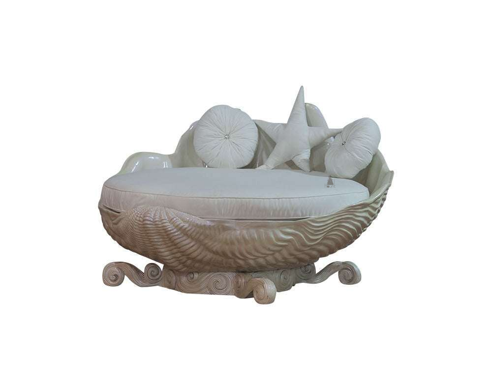 The Sirens Two Seater Love Seat, a handcrafted sculptural shell-shaped lounge with cushioned seating and curled base detailing.