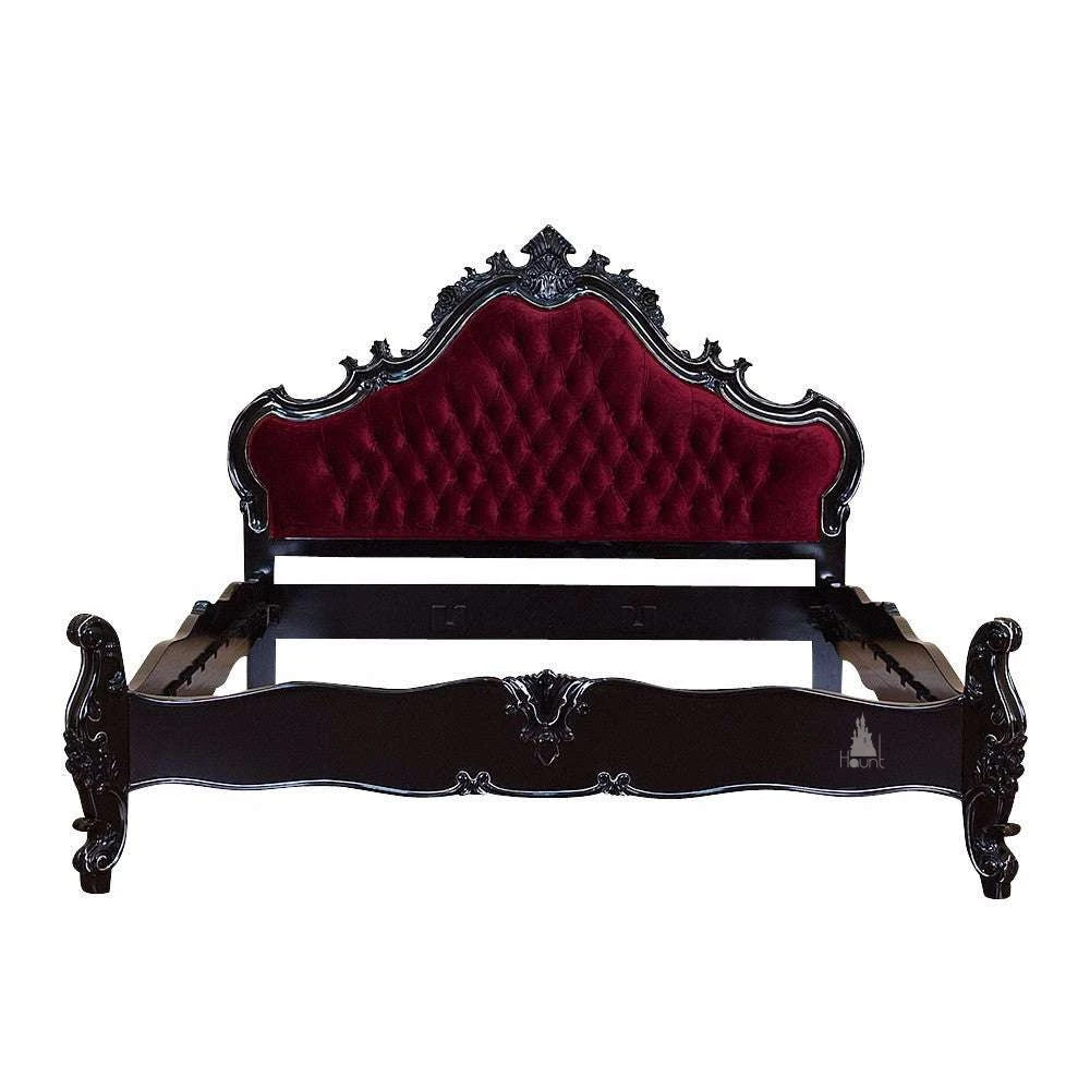 The Vampiress Bed, a handcrafted upholstered bed with a tall serpentine headboard, deep button tufting and carved gothic detailing.
