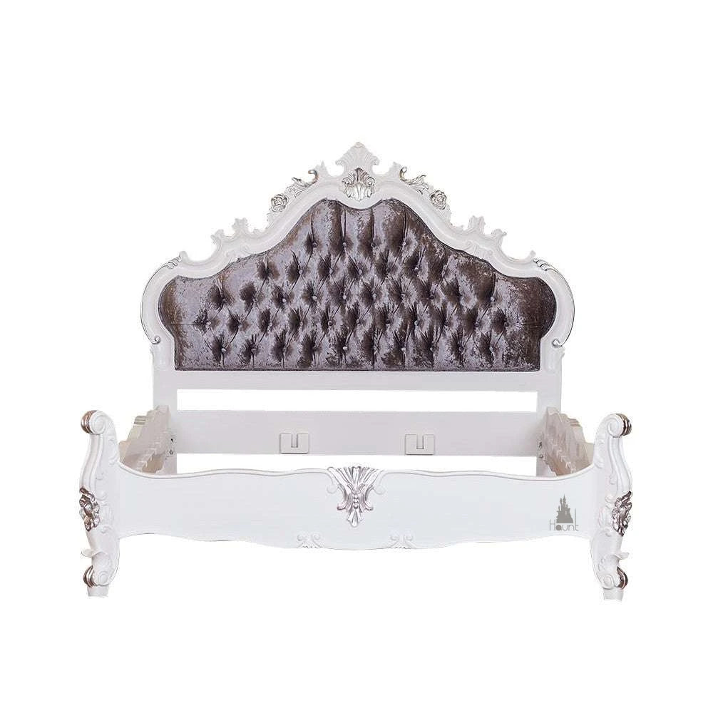 The Vampiress Bed, a handcrafted upholstered bed with a tall serpentine headboard, deep button tufting and carved gothic detailing.