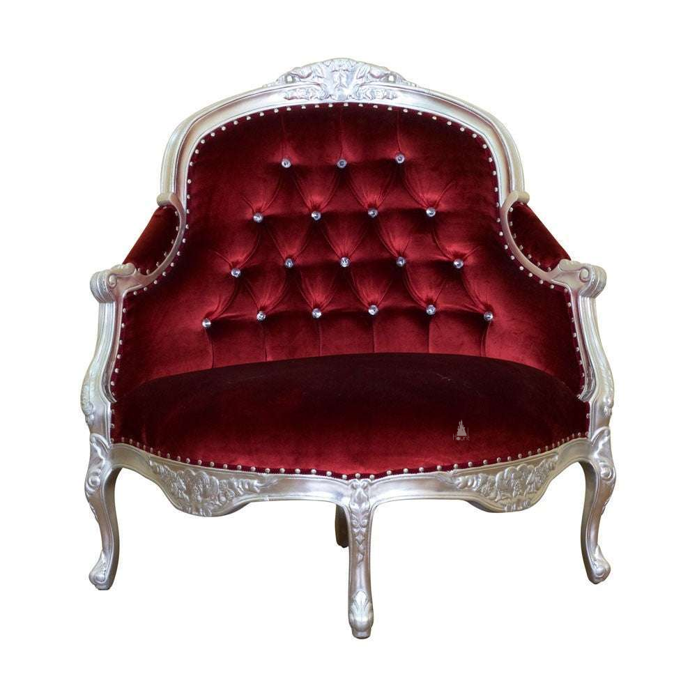 Vampiress Roundabout Parlour Chair by Haunt Cult, a curved red velvet parlour chair with a pale carved frame, button-tufted back, rounded arms, nailhead trim and cabriole legs, image 2