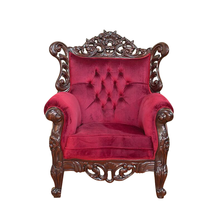 The Maleficent Occasional Chair, a handcrafted gothic armchair with button-tufted upholstery, rolled arms and ornate carved timber frame.