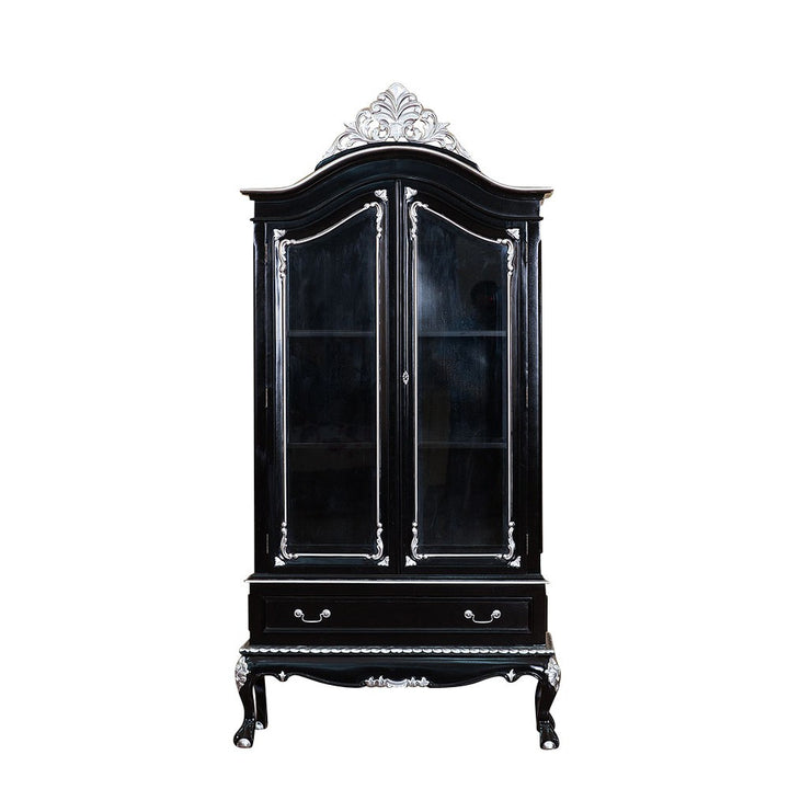 Seduce Display Cabinet, a black double-door glass cabinet crowned with a silver carved crest and finished with silver accents